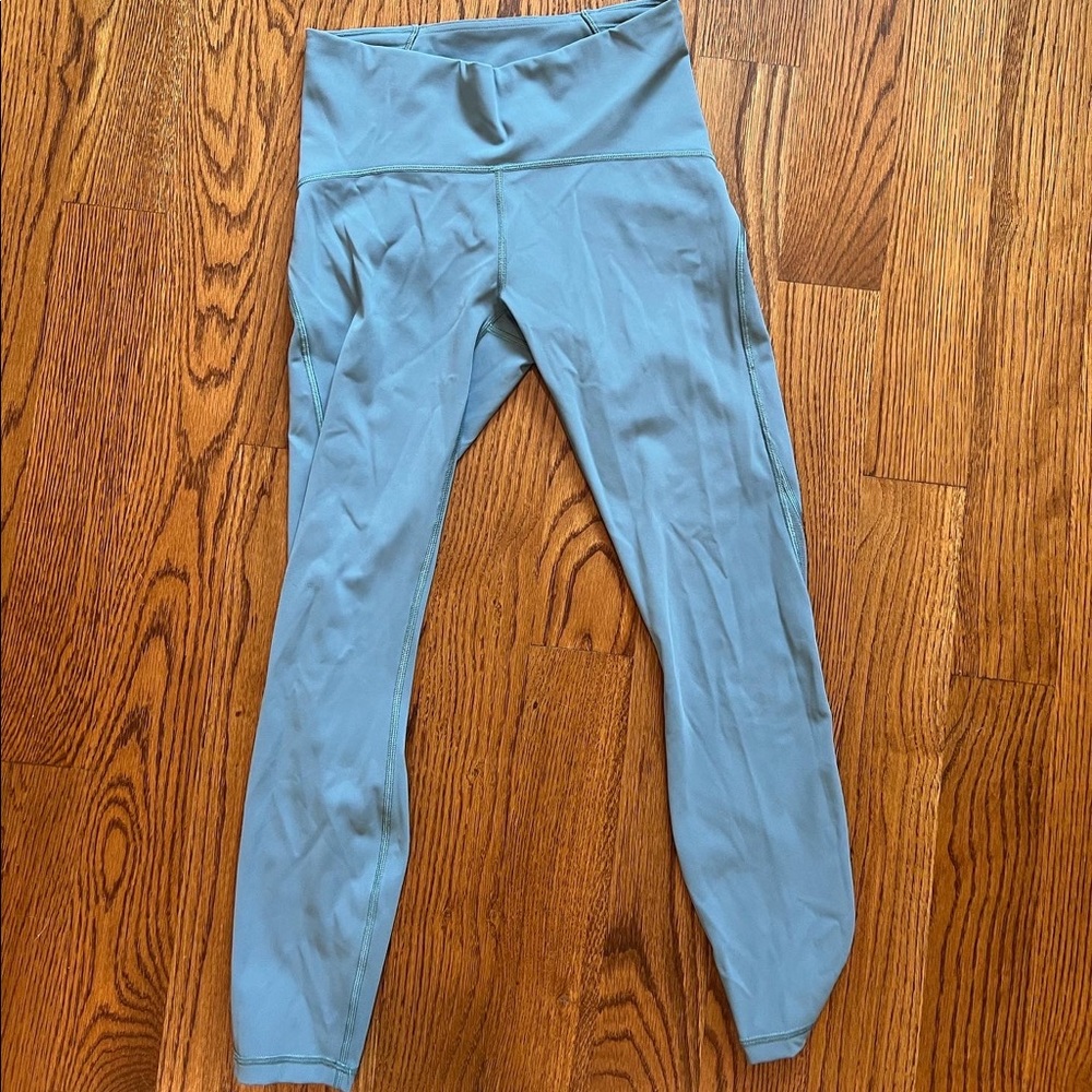 Lulu Lemon blue leggings with mesh on the side size 6